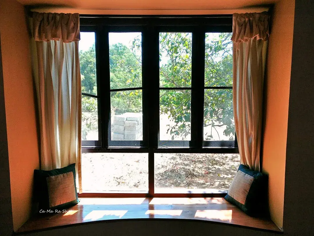 The Mango Mulch farmhouse set among century-old mango trees